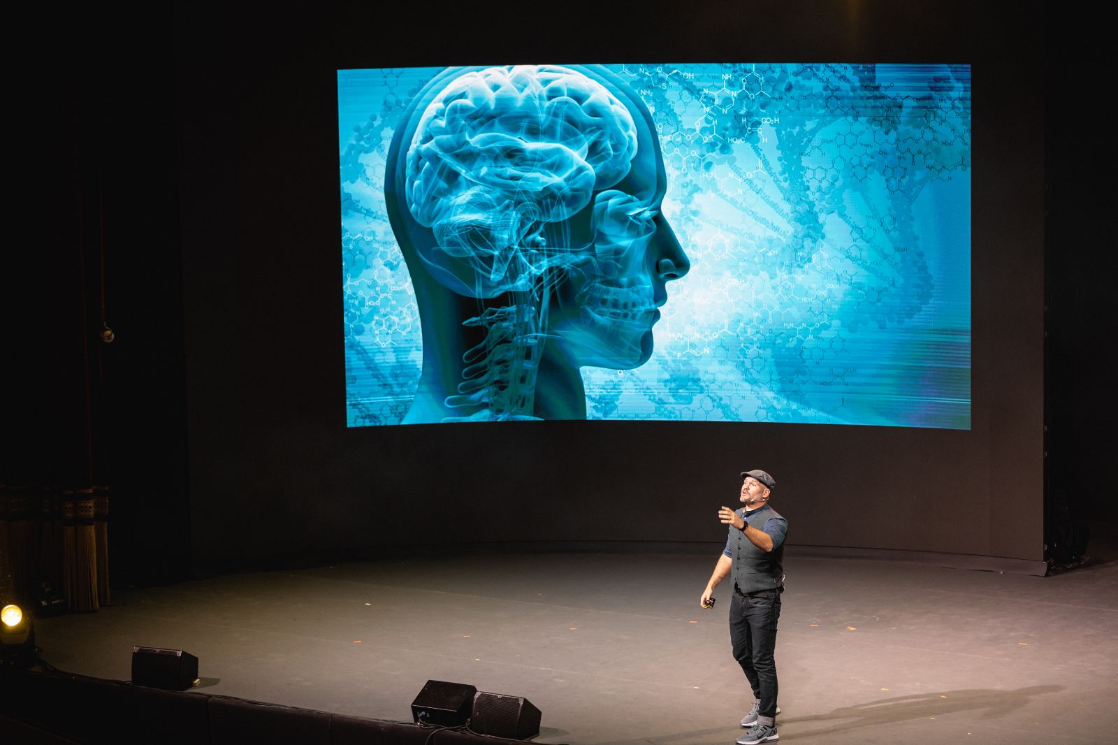 Alex speaking on stage